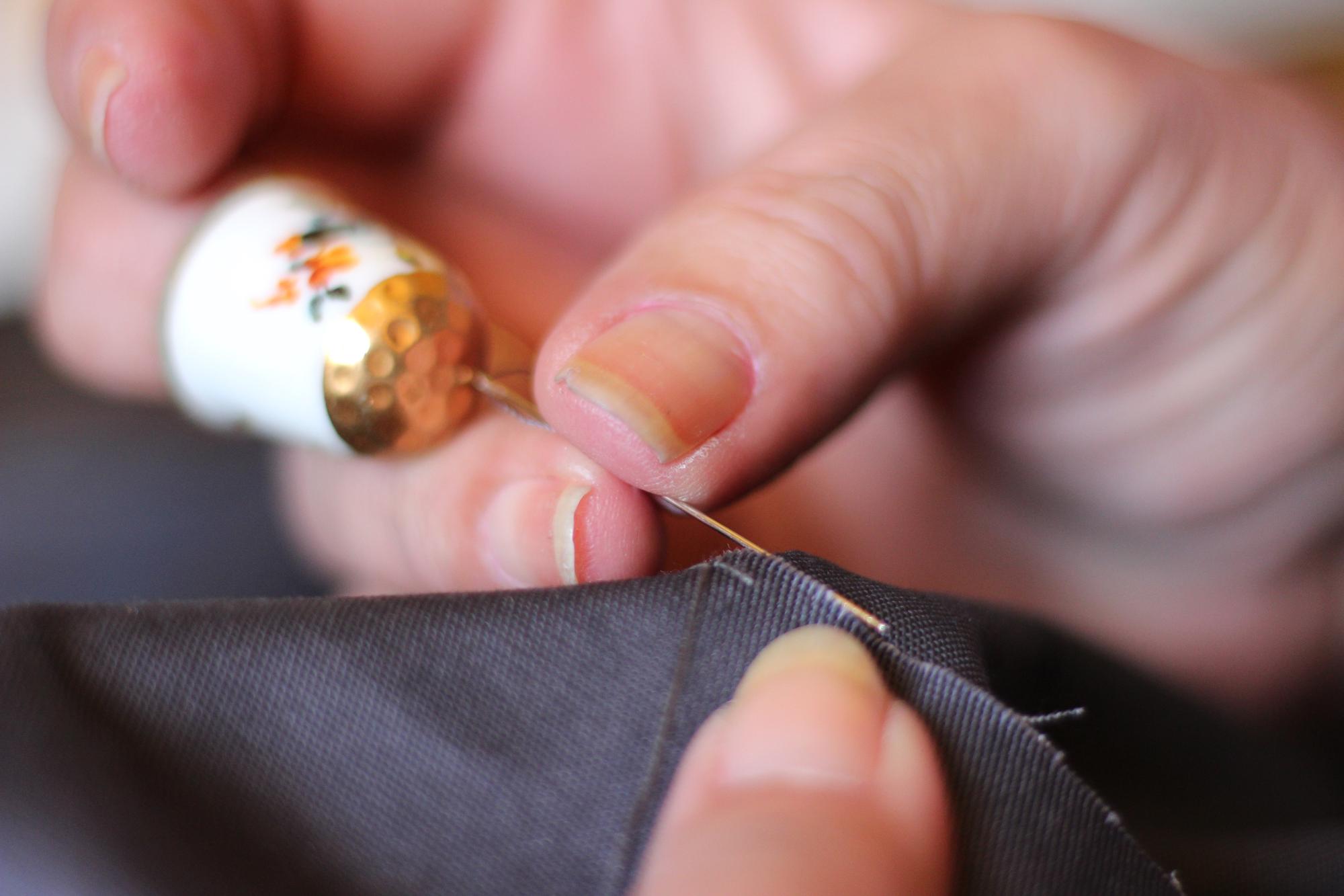 close-up of gold thread embroidery on silk